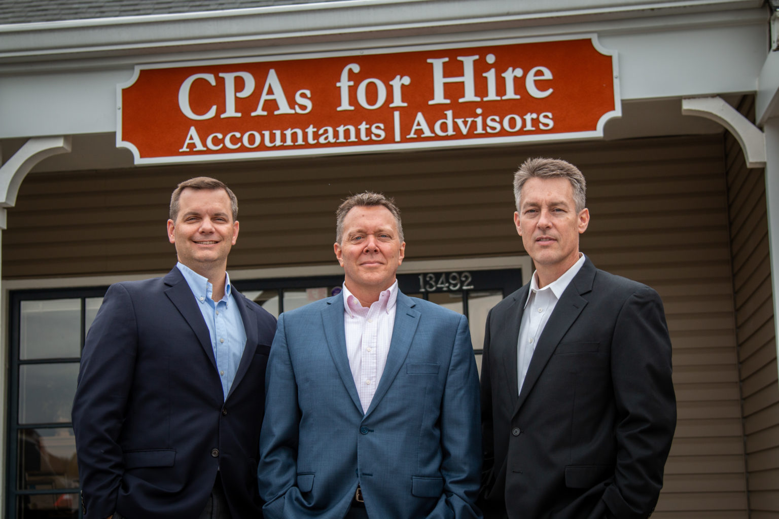 IMG_CPAs For Hire in front of building